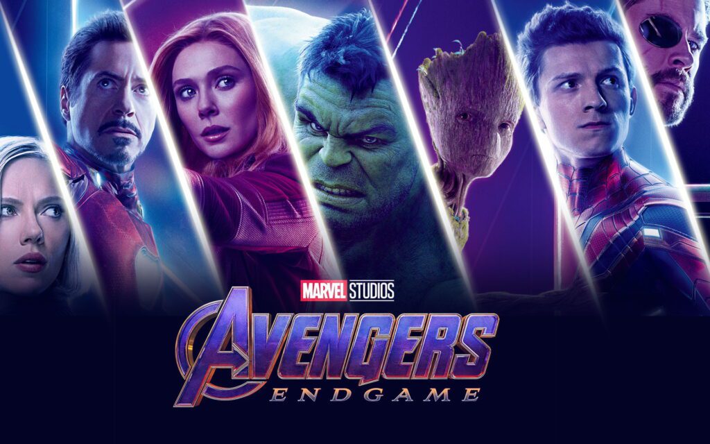 Poster oficial do filme 'Vingadores: Ultimato' apresentando, da esquerda para a direita, Viúva Negra, Homem de Ferro, Feiticeira Escarlate, Hulk, Groot, Homem-Aranha e Thor, acima do logotipo da Marvel e da inscrição 'Avengers: Endgame'.